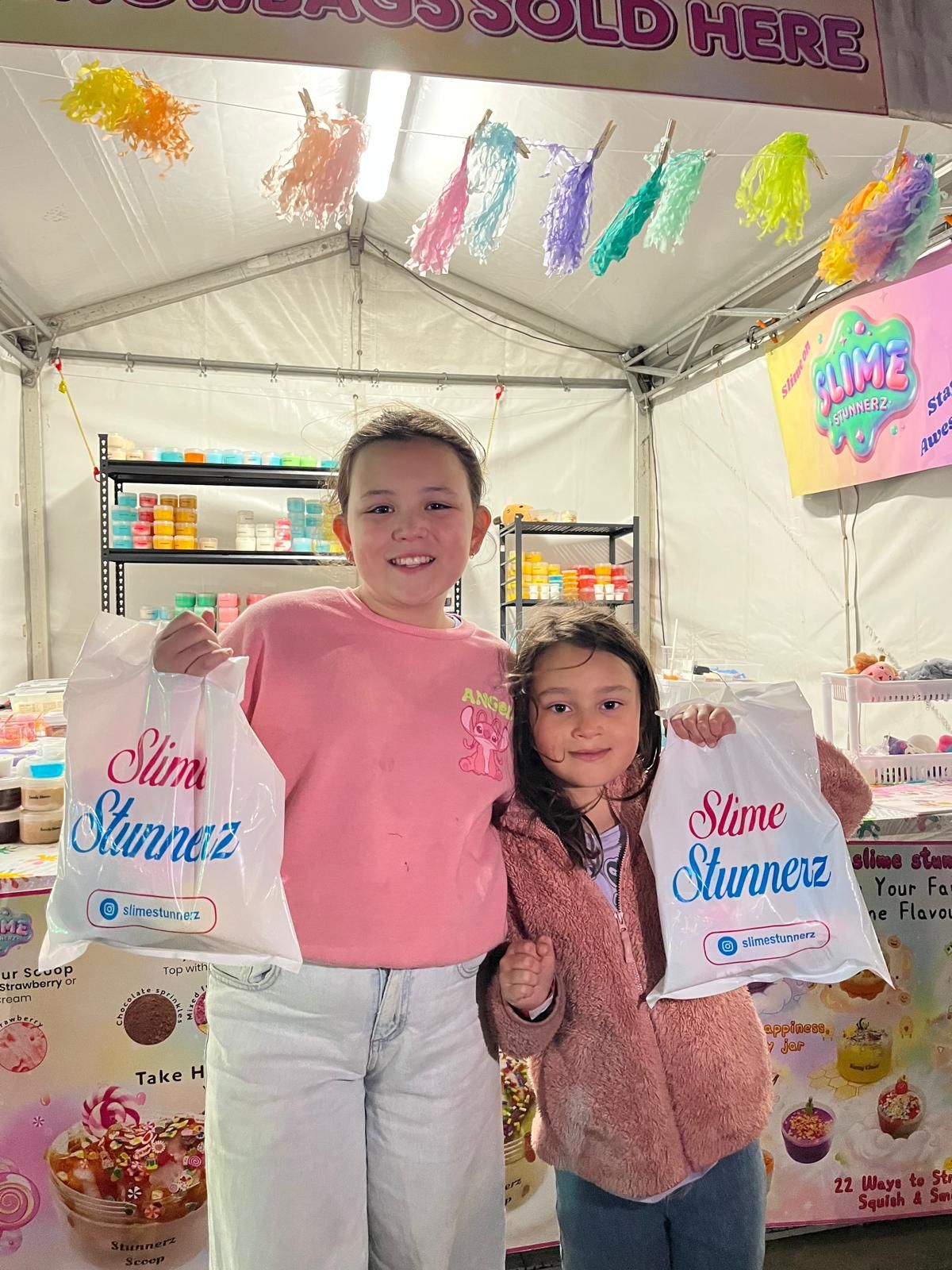 Two happy customers with SlimeStunnerz showbags