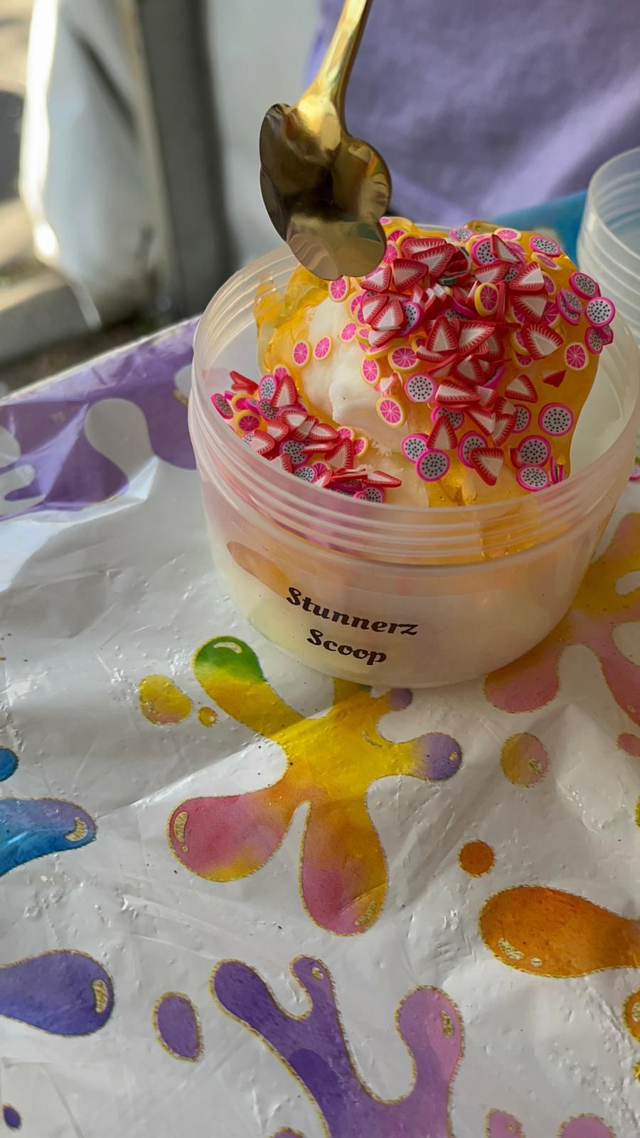 A Stunnerz Scoop slime topped with strawberry sprinkles